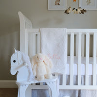 Full Name Monogrammed White Baby Quilt with pink letters - lifestyle