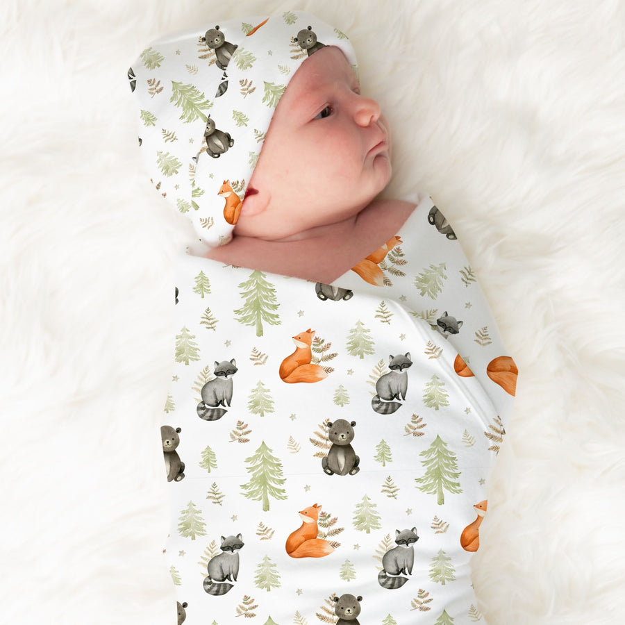 Baby wrapped in Woodland Animal-themed Minky Baby Swaddle Blanket